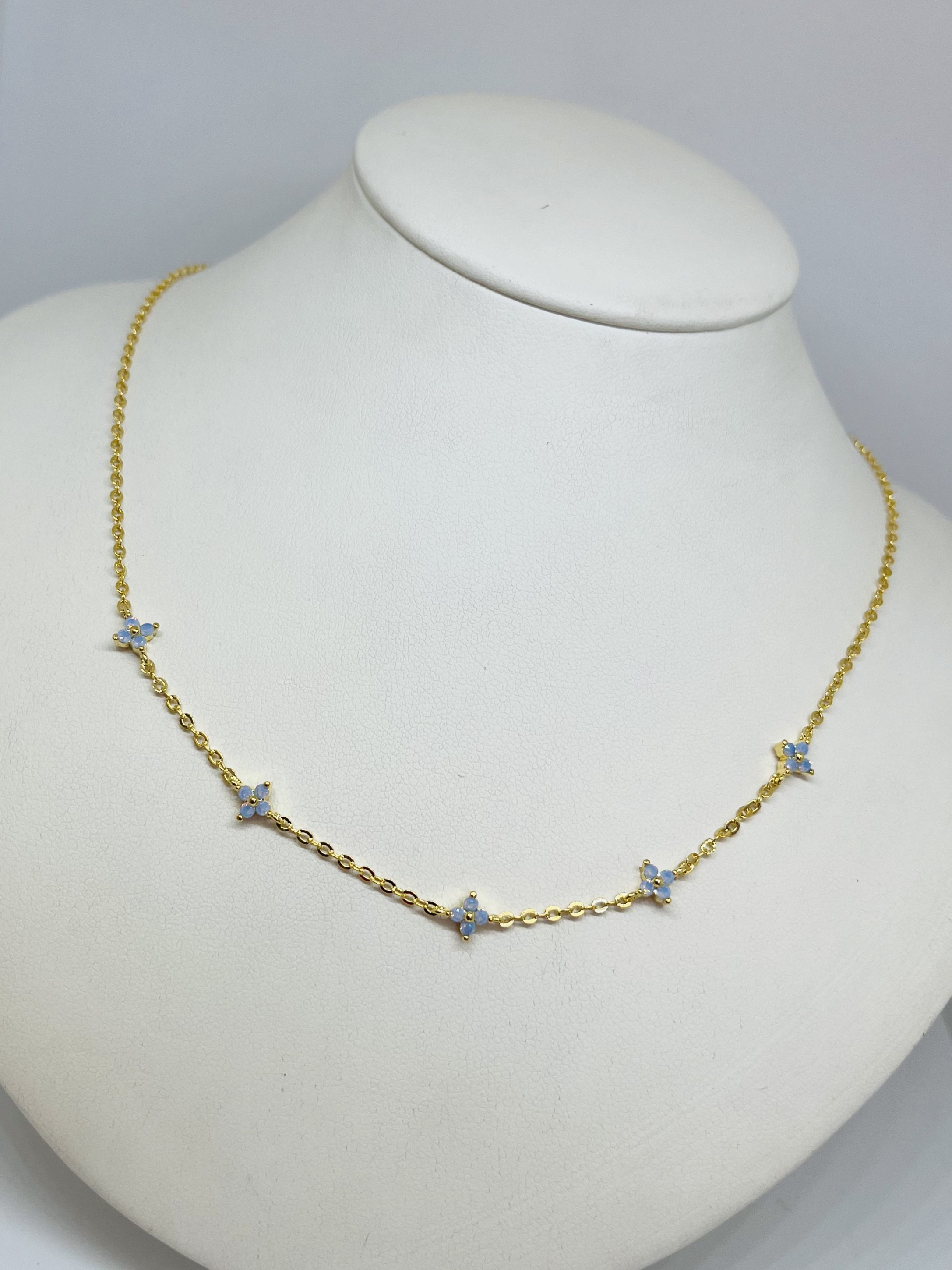 Choker dorado c/ flor celestes